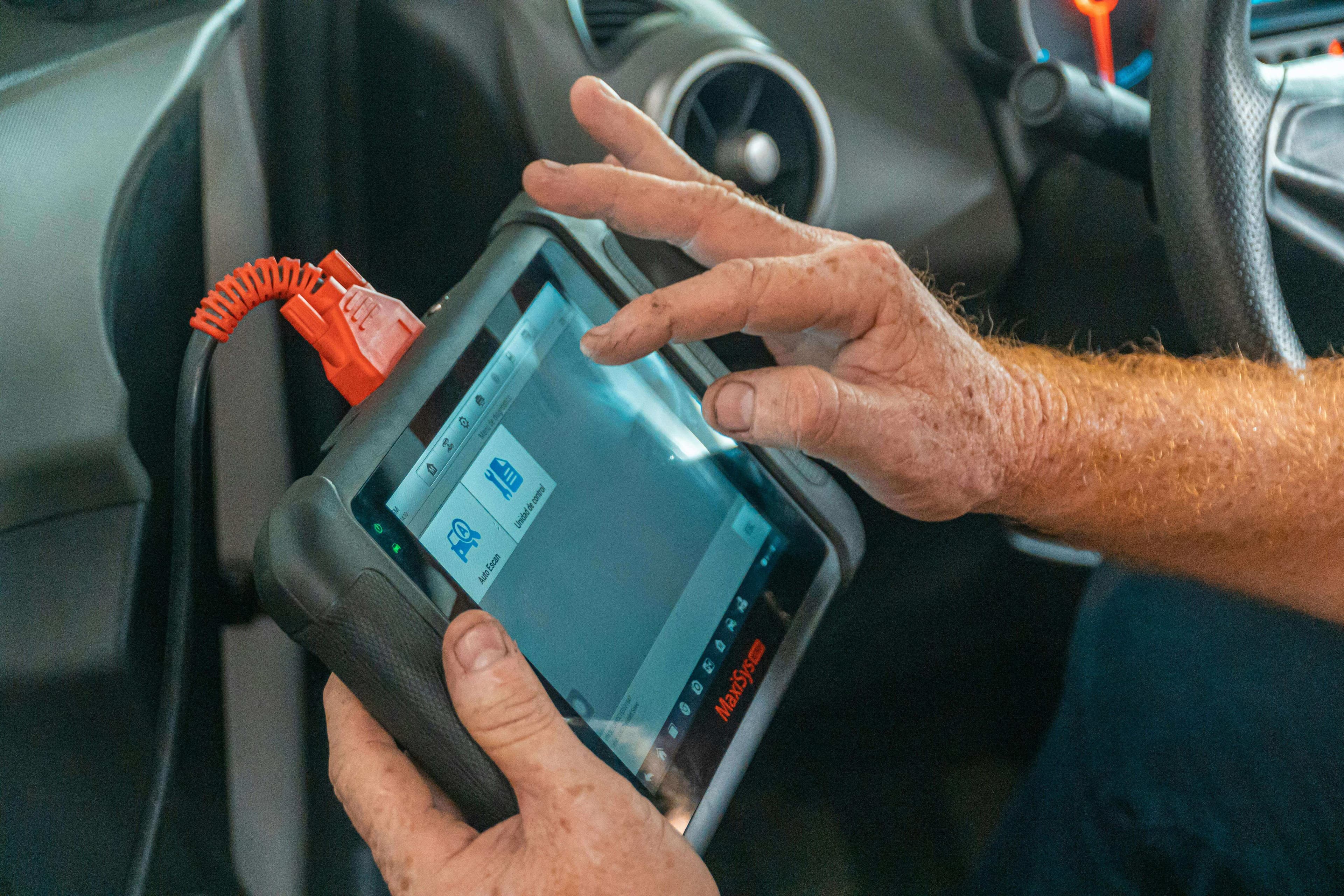 Diagnostic scan tool connected to HGV in workshop — JG Technical Ltd